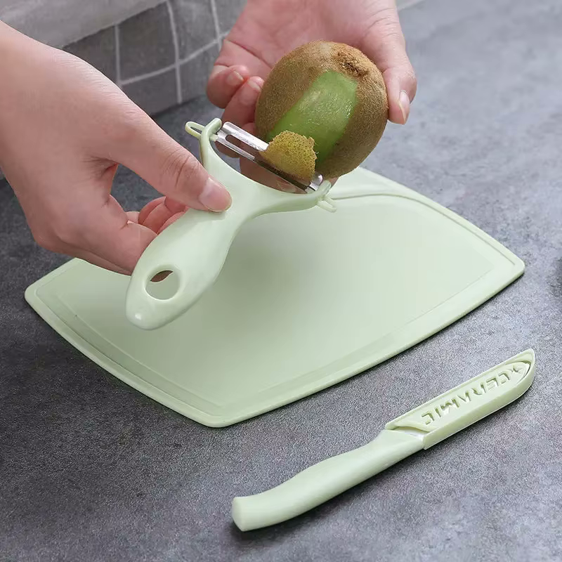 Fresh cut Mint Green chopping board, with knife and peeler